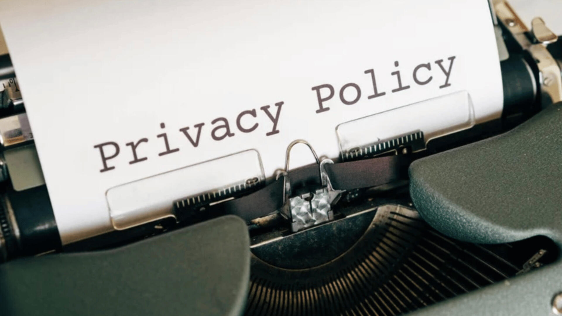 Privacy Policy – Your Data, Your Rights Close-up of a vintage typewriter with a sheet of paper that reads “Privacy Policy.” Symbolizes transparency and commitment to protecting user data and rights at Carlisha Writes & Co.