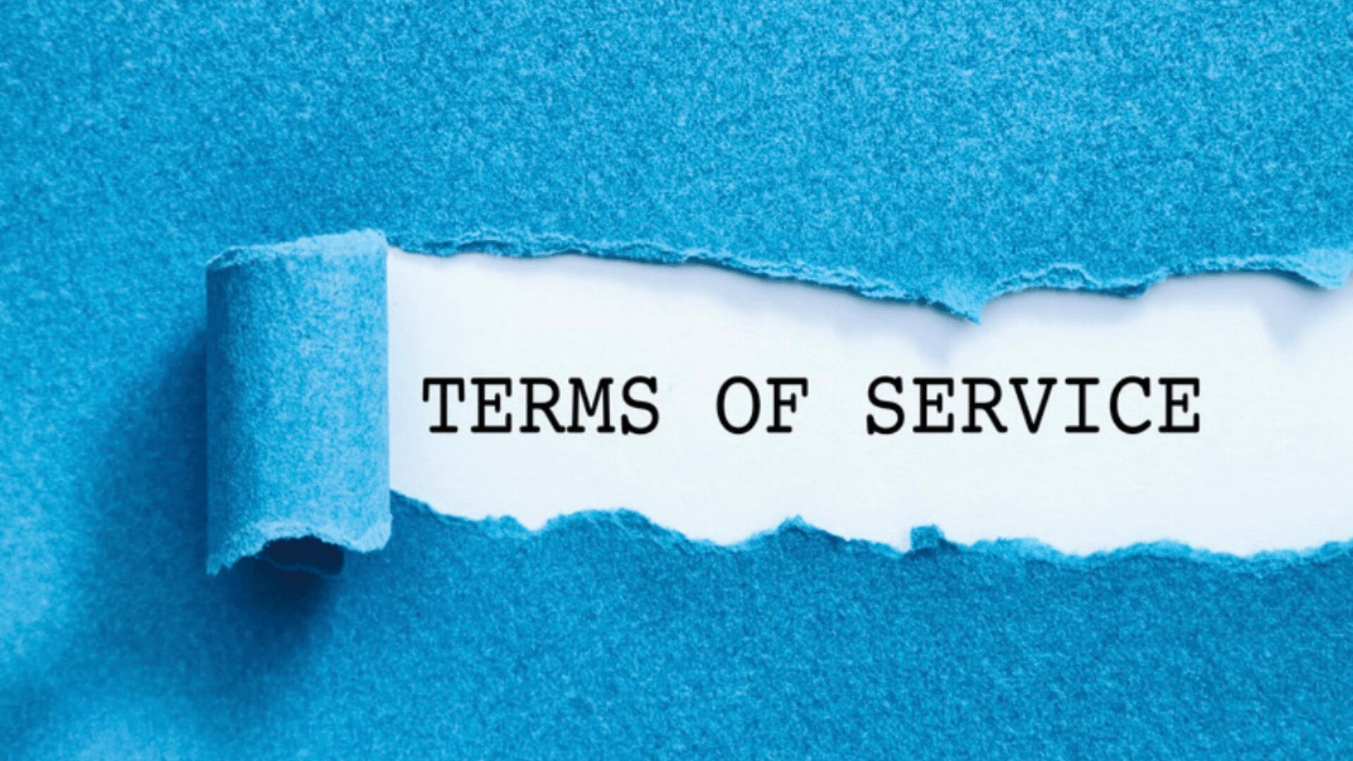 Clarity You Can Count On – Terms That Respect Your Voice A close-up image of a bright blue sheet of paper being peeled back to reveal the typed phrase “TERMS OF SERVICE” beneath—symbolizing transparency and access to user agreement policies.