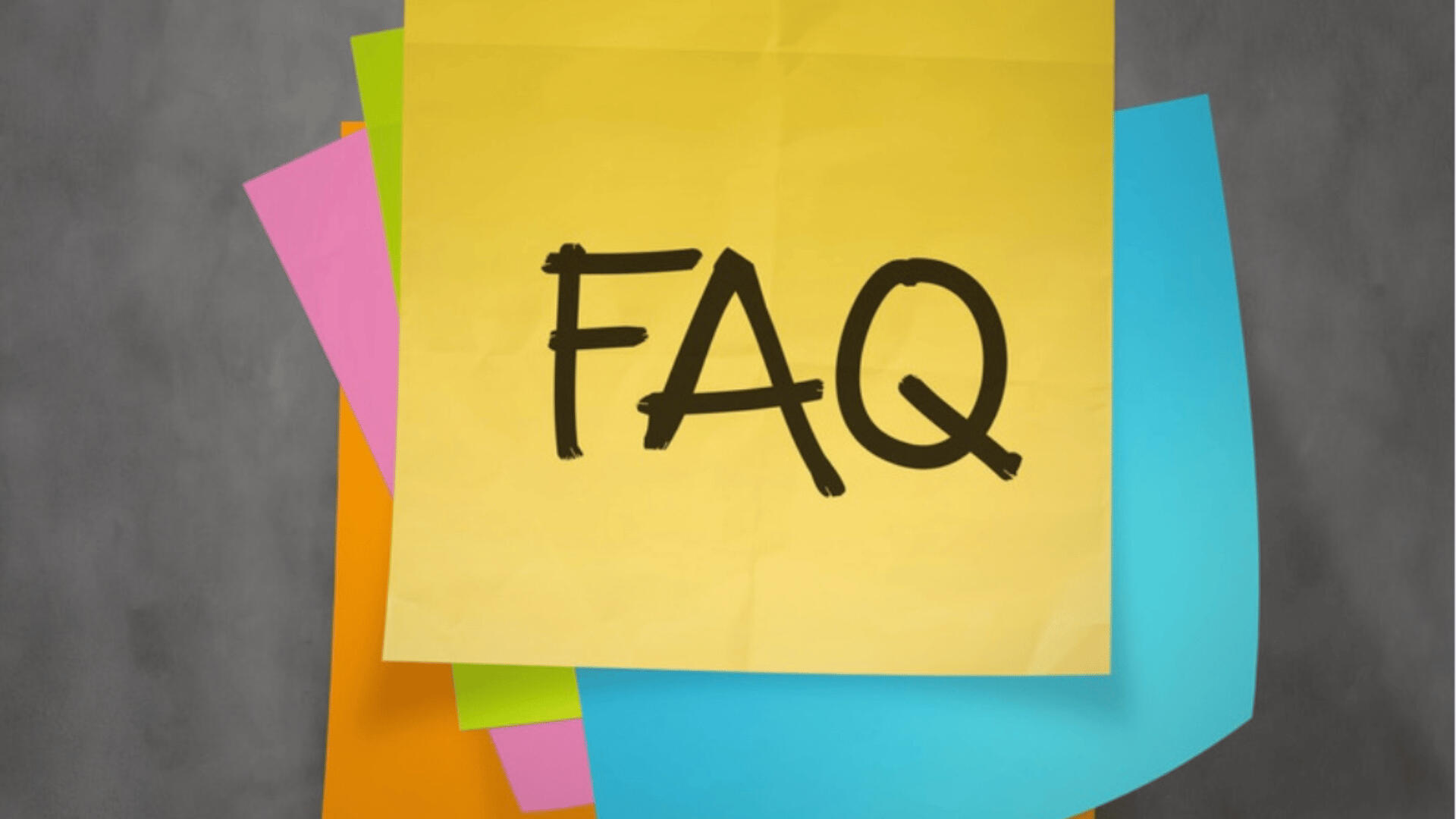 Got Questions? You’re Not Alone—Let’s Clear Things Up A colorful stack of sticky notes with the top yellow note prominently labeled “FAQ” in bold black letters—representing answers to common questions in a creative, friendly format.